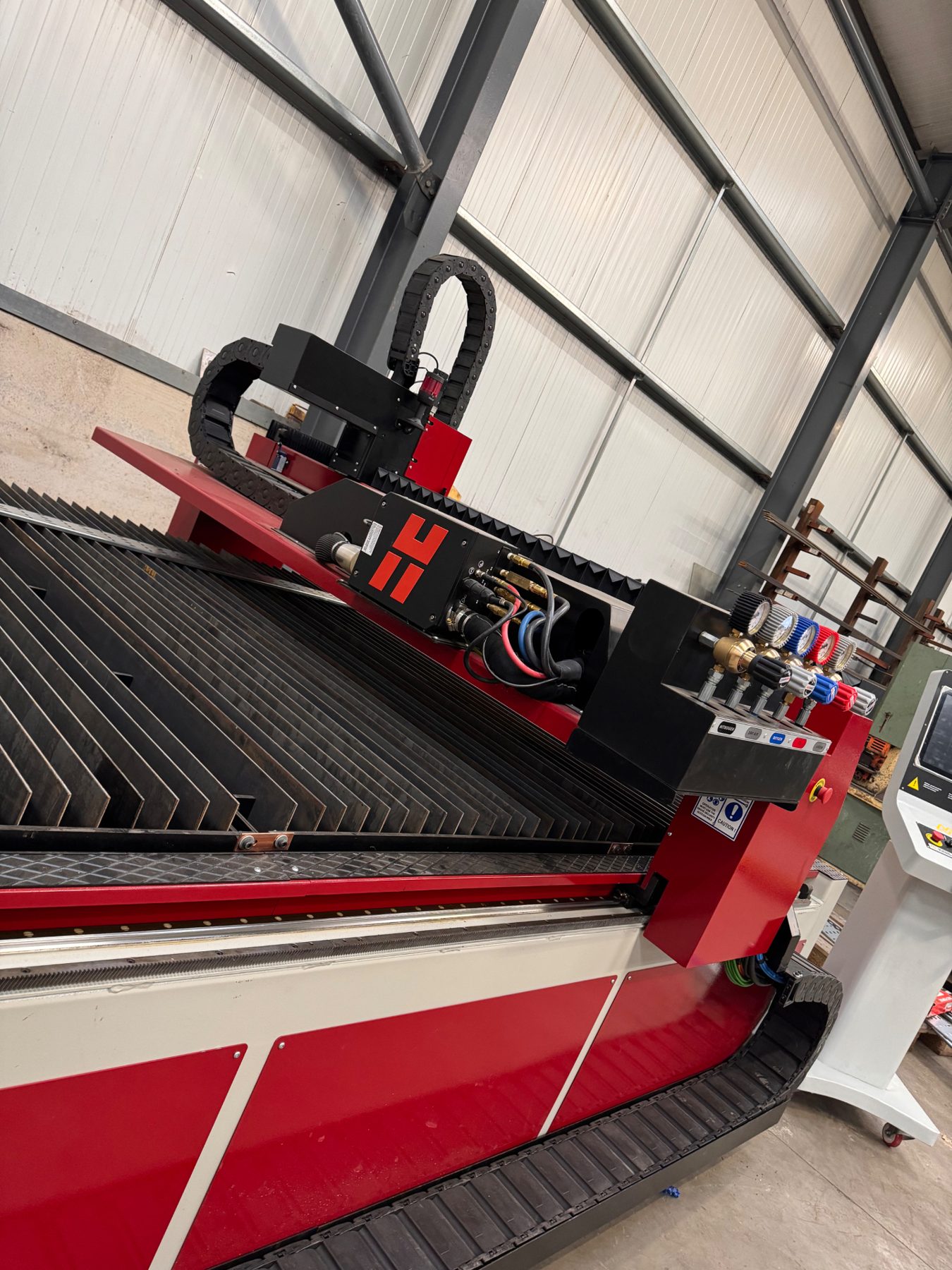 Close view of the Hypertherm XPR300 plasma cutting table and cutting head in the RPD workshop