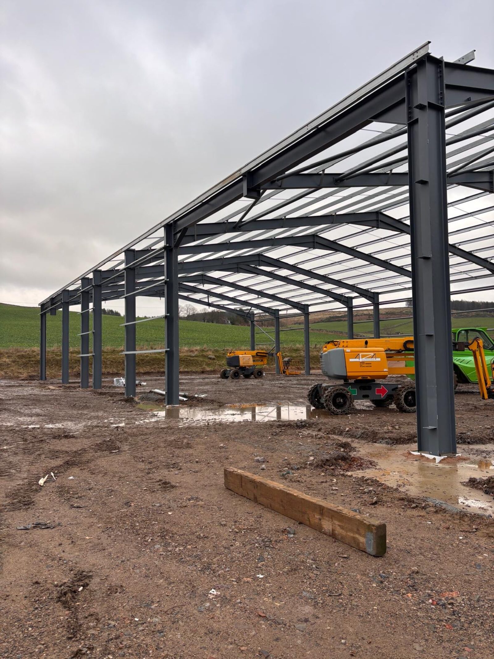 Steel frame and lean-to of the industrial building during erection
