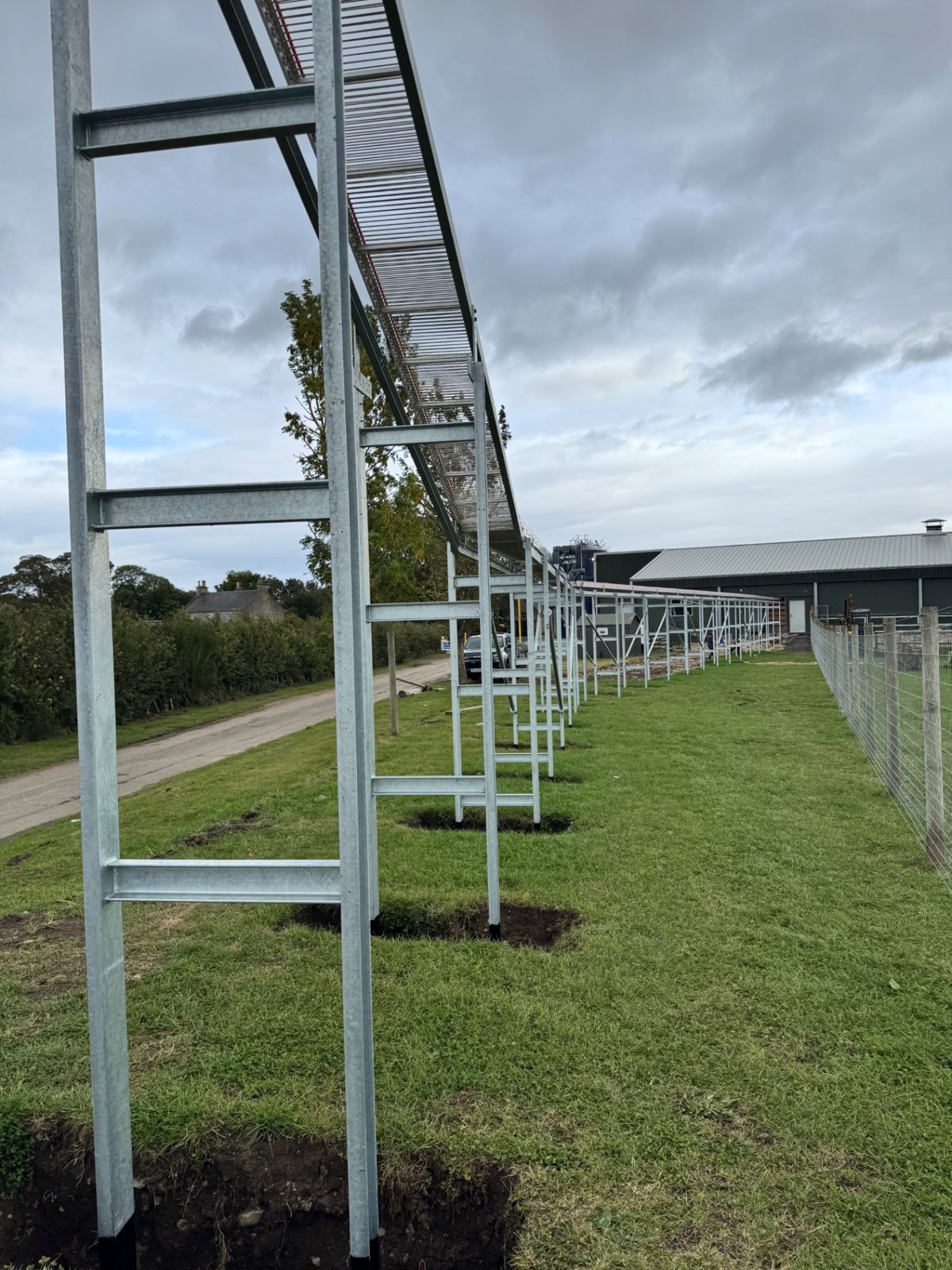 Galvanised support steelwork carrying the elevated egg conveyor route