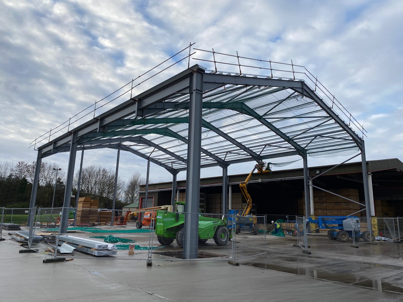 Portal frame steelwork erected over the existing yard at the Highlands development