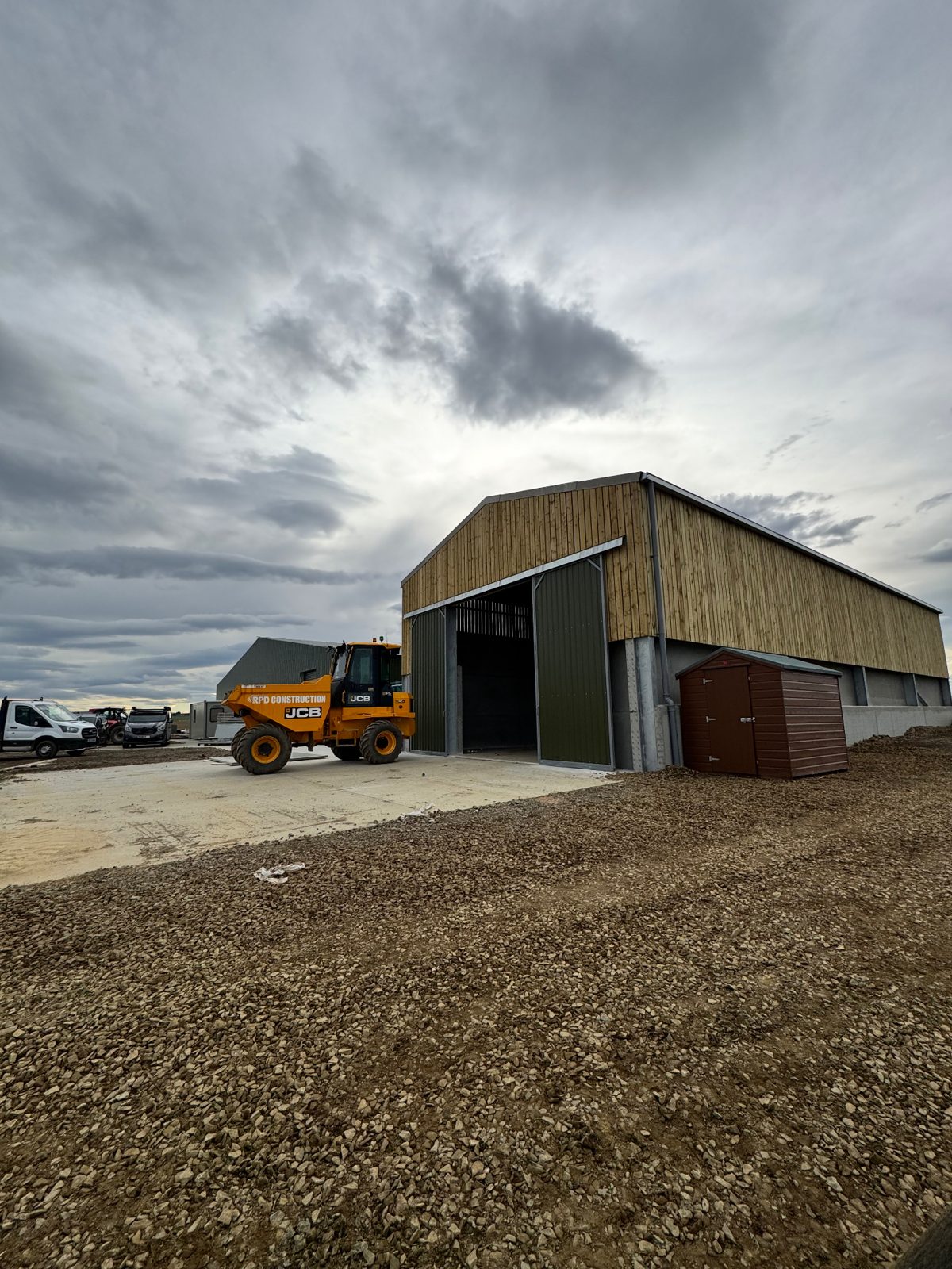 Exterior view of the completed poultry building with RPD machinery on the apron