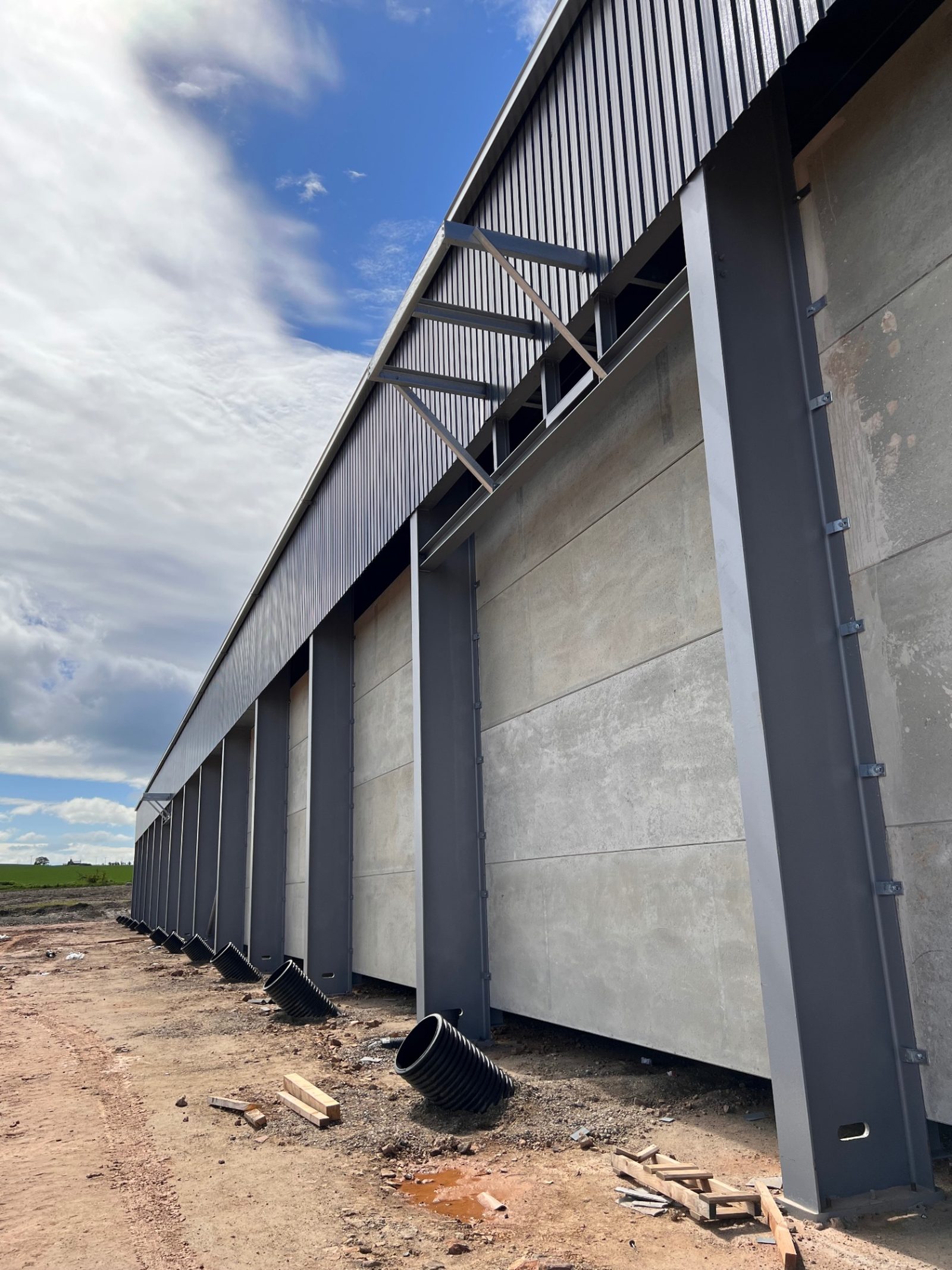 Tall precast concrete panels and structural steel at the grain storage building exterior