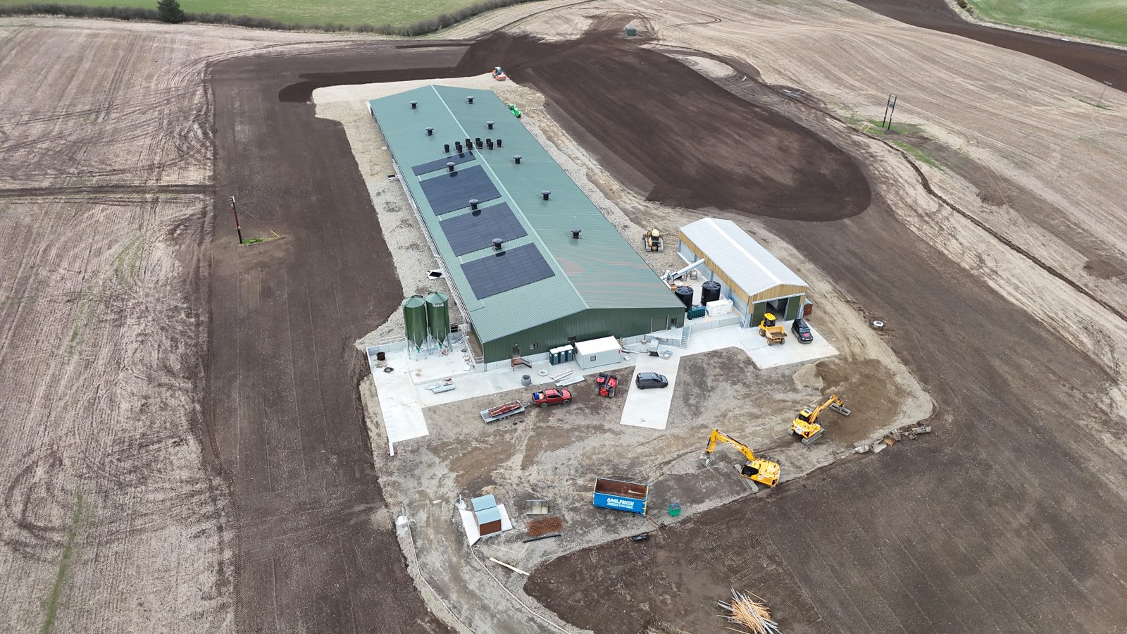 Wide aerial view of the poultry development in cultivated Aberdeenshire countryside